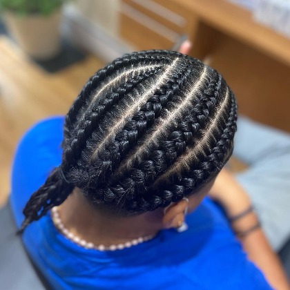 @braidsbyktrachaa's layered braids