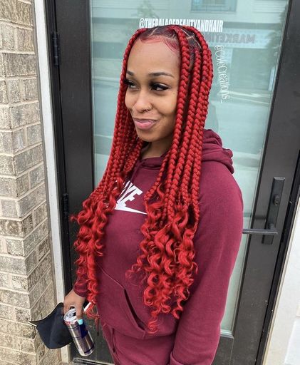 Coi Leray red braids